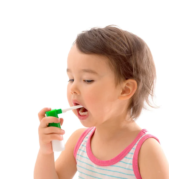 Little sick girl used medical spray for breath — Stock Photo, Image