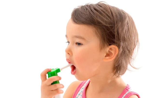 Little sick girl used medical spray for breath — Stock Photo, Image