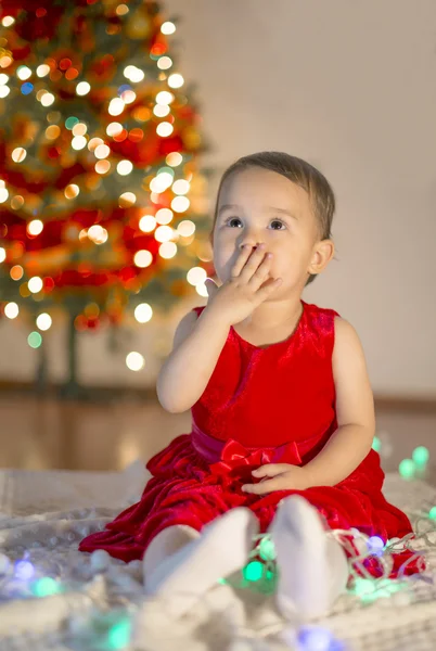 Little girl surprised by her first xmax gift — Stock Photo, Image