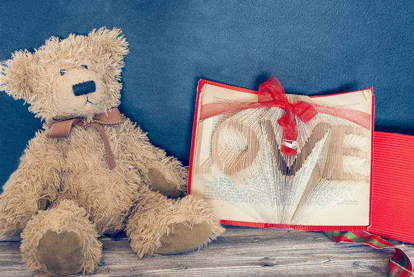 Old bear and vintage old book — Stock Photo, Image