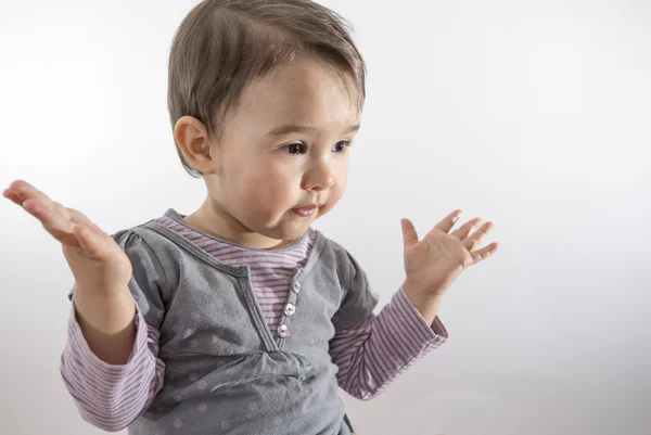 女の子は、白い背景で隔離の驚きを表現します。 — ストック写真