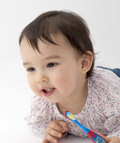 Meisje met tandenborstel in haar hand — Stockfoto