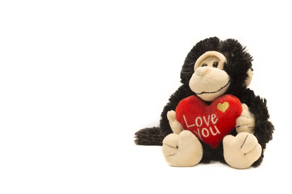 Macaco brinquedo plushy com I Love U sinal — Fotografia de Stock