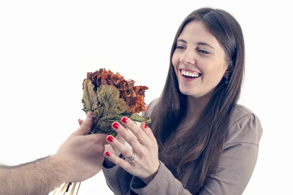 Beautiful girl receives a bouquet from her boyfriend — Stock Photo, Image