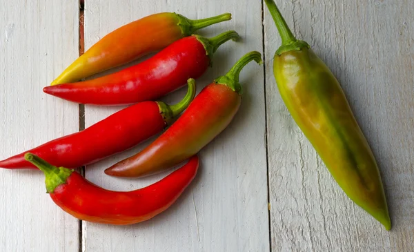 Paprika on white wooden table — Stock Photo, Image