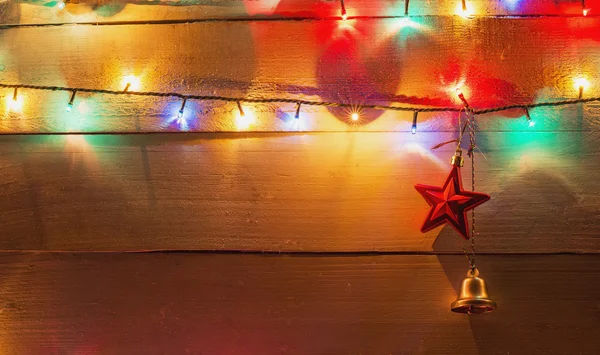 Sfondo luce di Natale e campanello decorativo e stella — Foto Stock