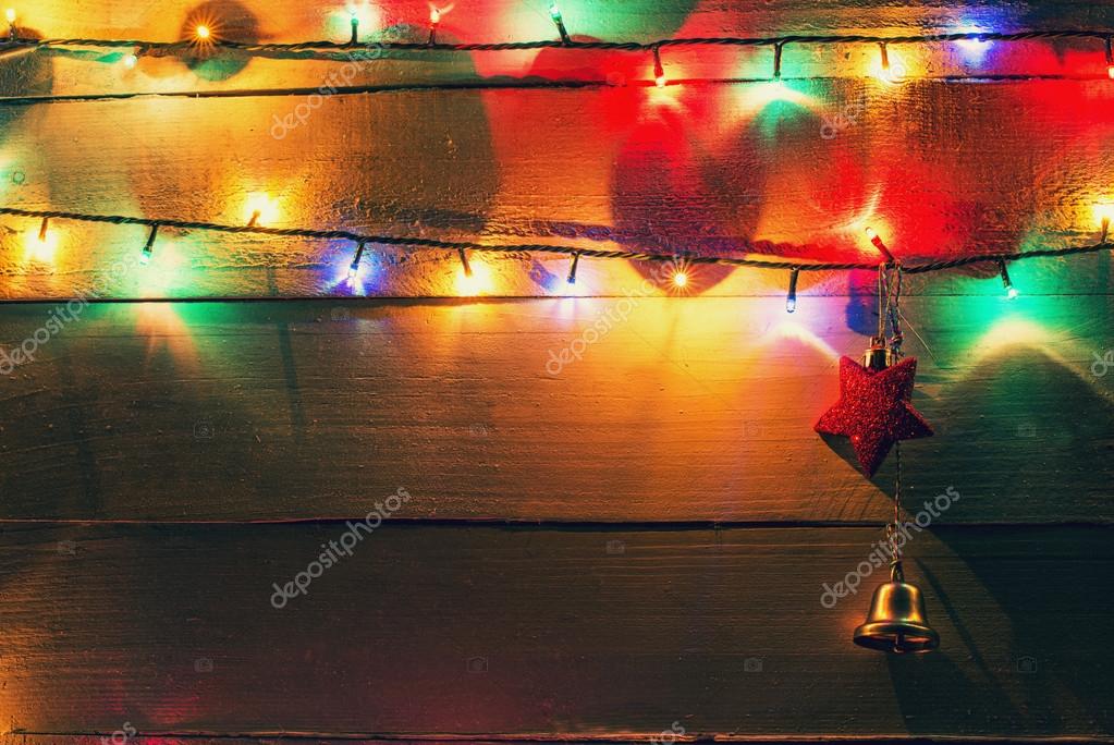 Christmas lights and globes on wood background Stock Photo by ©tutye