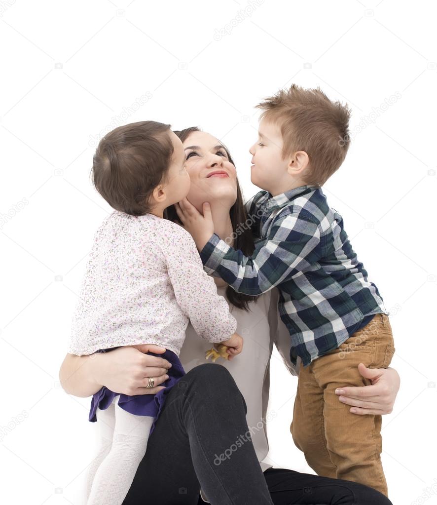 two little kids having fun with their mother