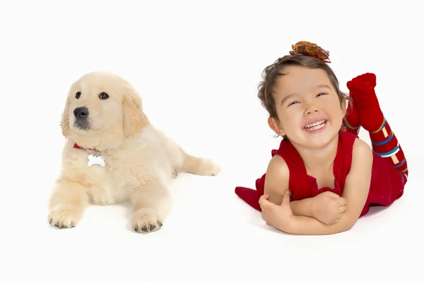 Little girl with a Golden retriever puppy — Stock Photo, Image