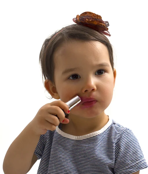 Fashion little girl applying lipstick — Stock Photo, Image