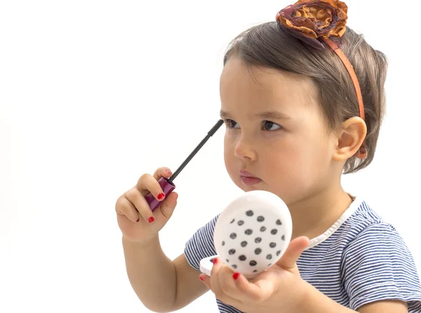 Fashion little girl applying make up — Stock Photo, Image