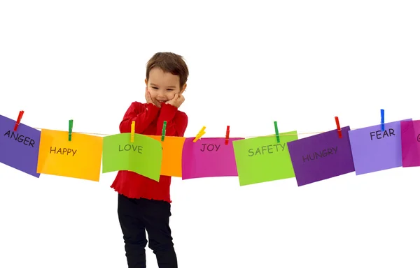 Little girl hanging her feelings on a rope — Stock Photo, Image