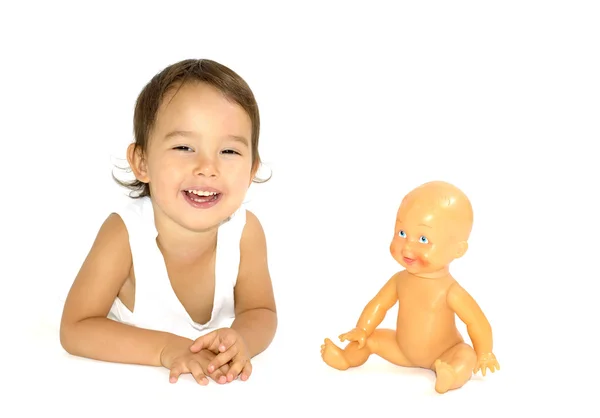 Little girl playing with her doll in studio — Stock Photo, Image