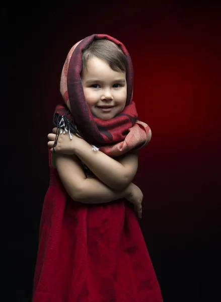 Cute child shivering in the cold isolated on black — Stock Photo, Image