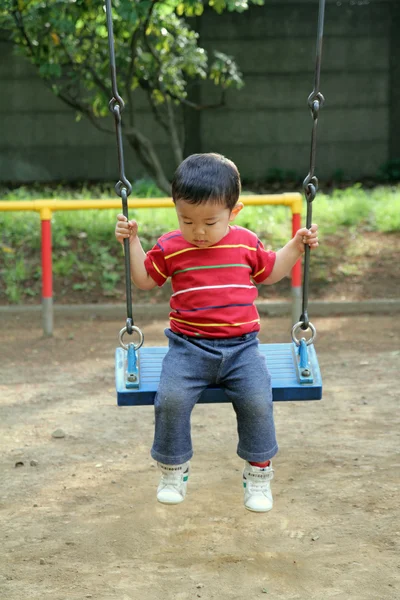 Japanese boy on the swing (1 year old) — Stock Photo, Image