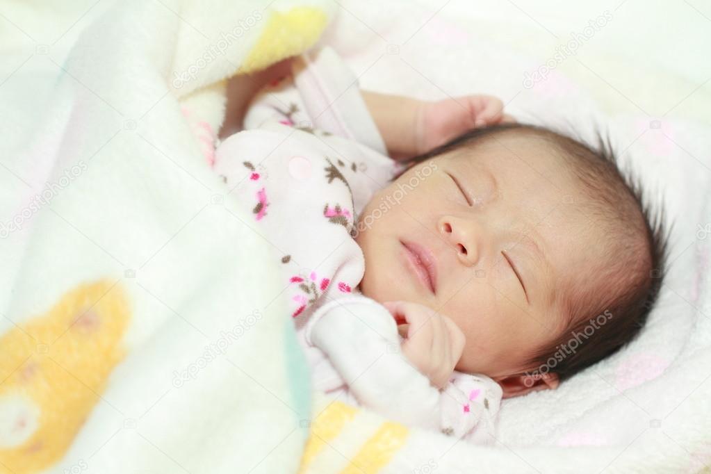 Sleeping Japanese new born baby girl (0 year old)