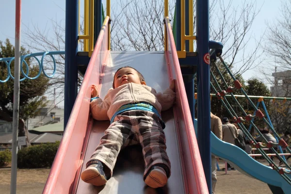 Japanese boy on the slide (1 year old) — Stock Photo, Image