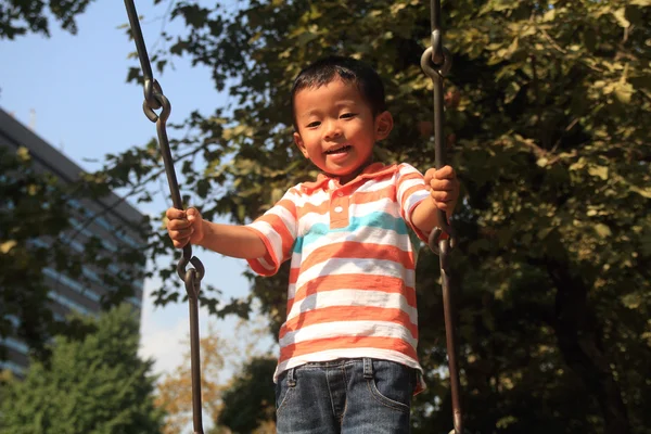 Japanese boy on the swing (3 years old) — Stock Photo, Image