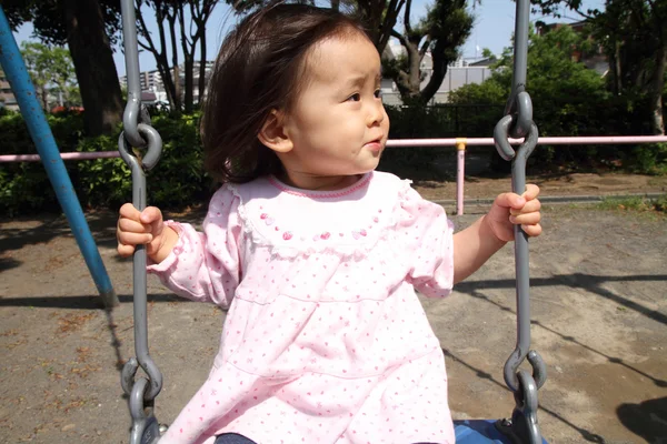 Japanese girl on the swing (1 year old) — Stock Photo, Image