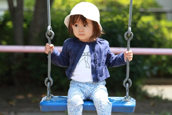 Japanese girl on the swing (1 year old) — Stock Photo, Image