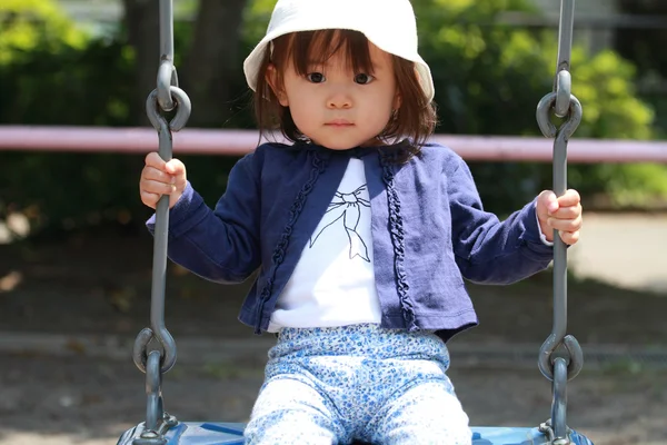 Japanese girl on the swing (1 year old) — Stock Photo, Image