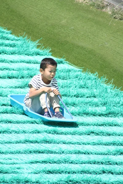 Japanese boy on the sled (first grade at elementary school)