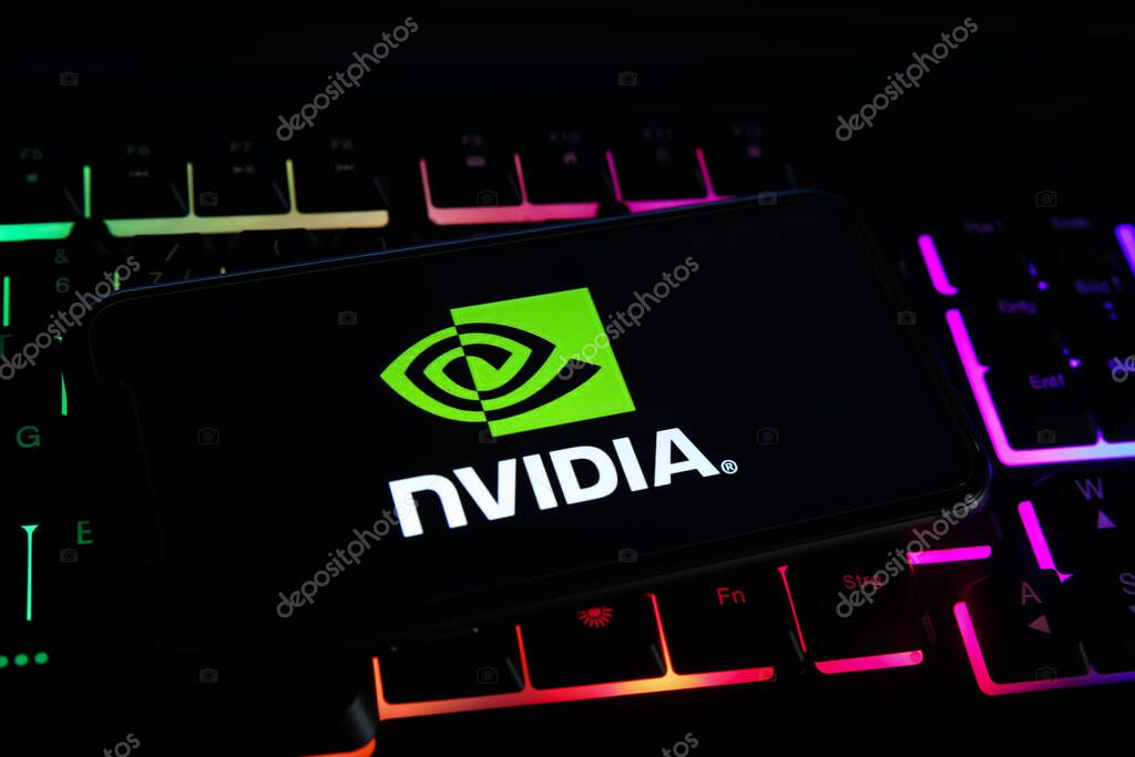 Viersen, Germany - May 1. 2021: Closeup of mobile phone screen with logo lettering of nvidia corporation on computer keyboard