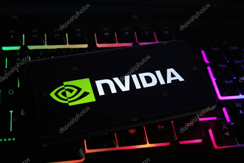 Viersen, Germany - May 1. 2021: Closeup of mobile phone screen with logo lettering of nvidia corporation on computer keyboard