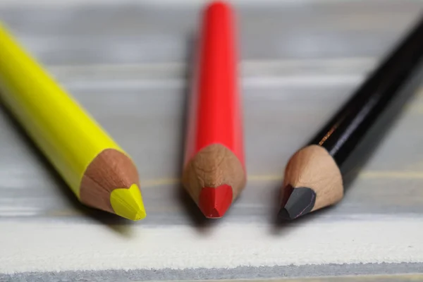 Closeup Isolated Colorful Yellow Red Black Crayons Wood Background Germany — 스톡 사진