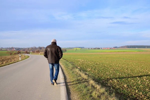 Autumn Man Walks Alone Deserted Road Leads Harvested Fields Blue — Stock Photo, Image