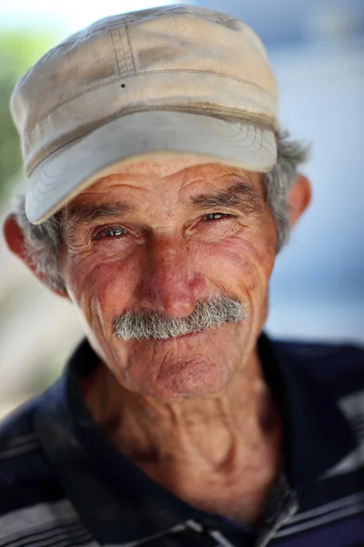 Portrait of an old wine merchant. — Stock Photo, Image