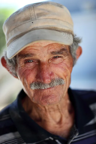 Portrait of an old wine merchant. Stock Image