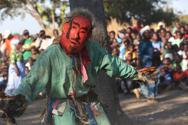 Traditional Nyau dancer with face mask