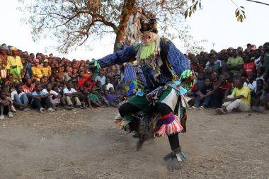 Traditional Nyau dancer with face mask
