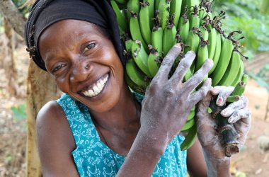 Woman carrying bananas, Tanzania