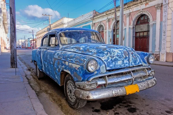 Patched up old American car in Cienfuegos, Cuba Royalty Free Stock Photos