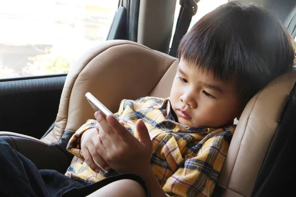 Asian Boy Looking Smartphone Screen Child Sitting Car Seat Watch — Stock Photo, Image