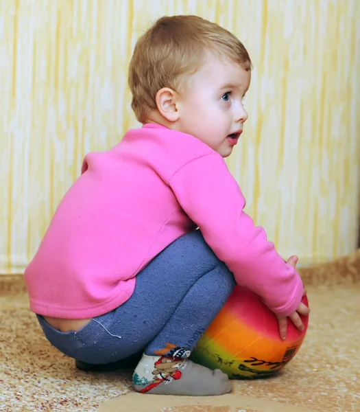 Happy boy with a color ball — Stock Photo, Image