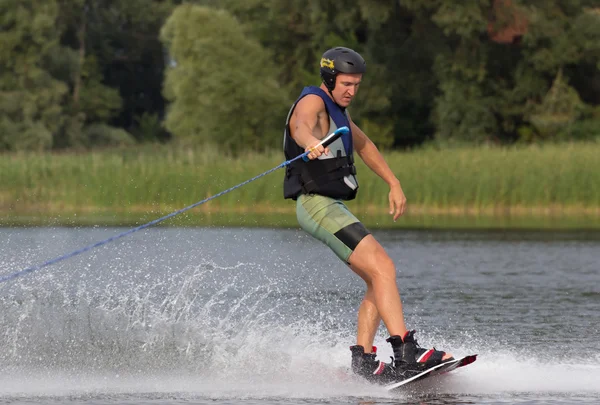 Athlete doing tricks on a wakeboard — Stock Photo, Image