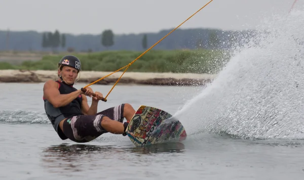 Wakeboarder making tricks on sunset. Wakeboarding Cup — Stock Photo, Image