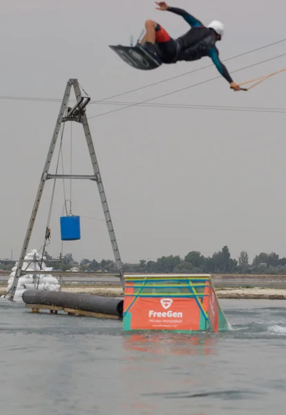 Wakeboarder making tricks on sunset. Wakeboarding Cup — Stock Photo, Image