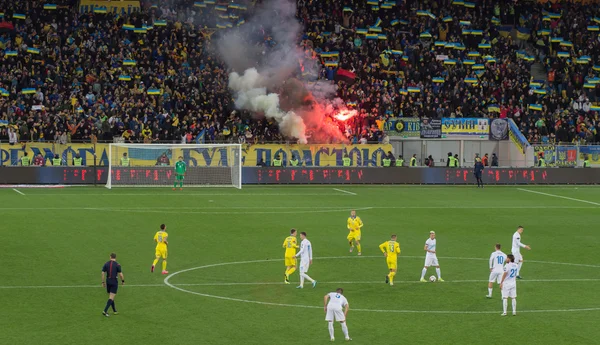 LVIV, UKRAINE - NOWEMBER 14: Terrorists fans disrupted  football match Ukraine Slovenia burning and explosion  fireworks packages. Bate on Nowember 14, 2015  Lviv, Ukraine — Stock Photo, Image