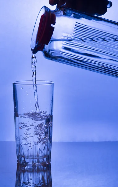 Water  poured  into a glass — Stock Photo, Image