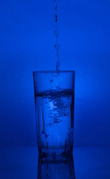 Water  poured  into a glass — Stock Photo, Image