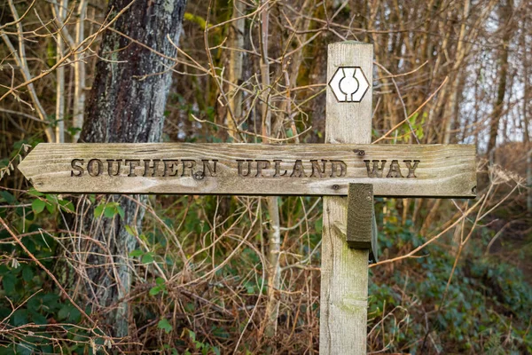 Wooden sign post for the Southern Uplands way path in Galloway, Scotland
