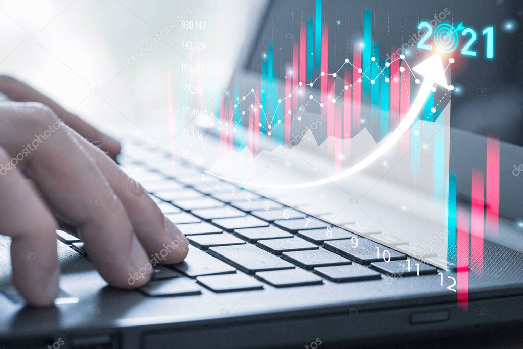 Business investor using computer laptop to analysis beautiful virtual stock market chart , business analyze by use technology concept.