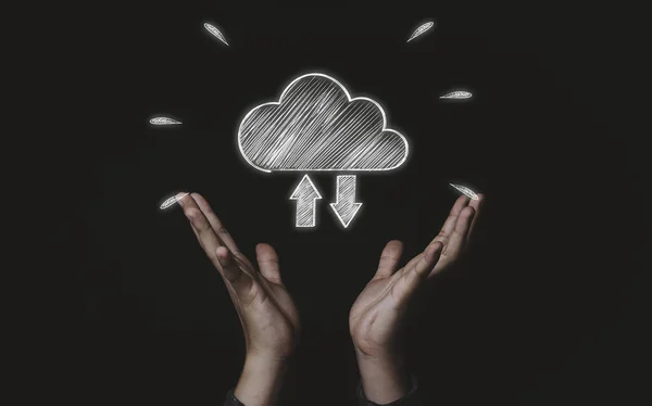 Two hand holding white cloud computing icon from hand drawing , Cloud computer technology is storage for sharing data information and upload download concept.