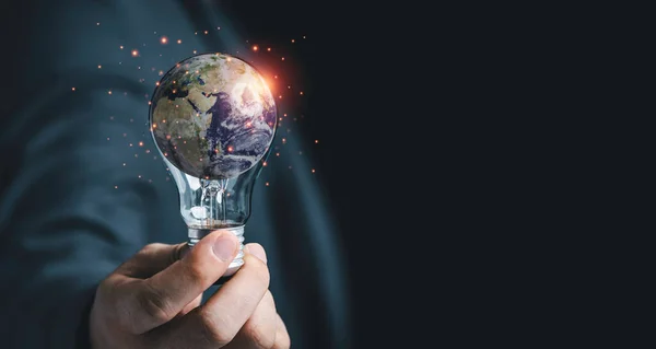 Businessman holding lightbulb with Earth for earth day and saving energy environment concept ,Element of this image from NASA and 3d render.