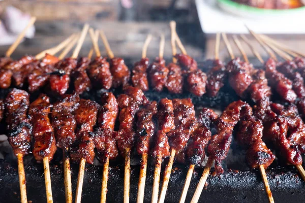 stock image One of the typically Indonesian foods is satay or sate. This food is made from beef or mutton or chicken which is grilled over smoky coals then served with peanut sauce and soy sauce.