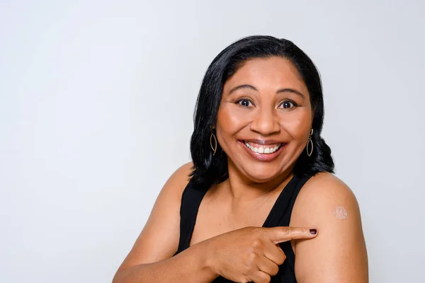 Woman Smiles Happily Shows Sticker Showing She Has Been Vaccinated — Fotografia de Stock